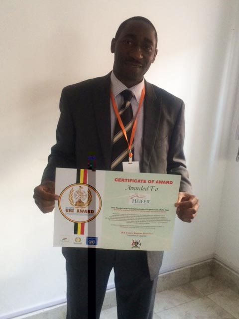 William Matovu, Heifer Uganda Interim Country Director, receives Africa Responsible Investment Award. Heifer Uganda Award