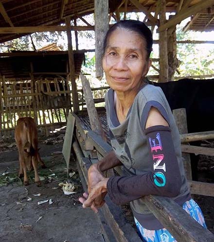 Pilipine Geldore stands with her Lalay in the cow shed. Pilipine Geldore stands with her Lalay in the cow shed.