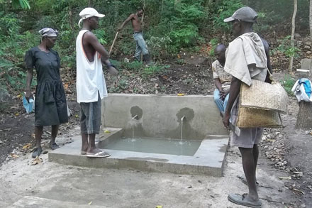 Community members started using the water point at Jondefe in May. Heifer participants pitched in to help dig the water pipelines. All who use the system will be trained in water conservation and the prevention on contamination. Community members at a water point